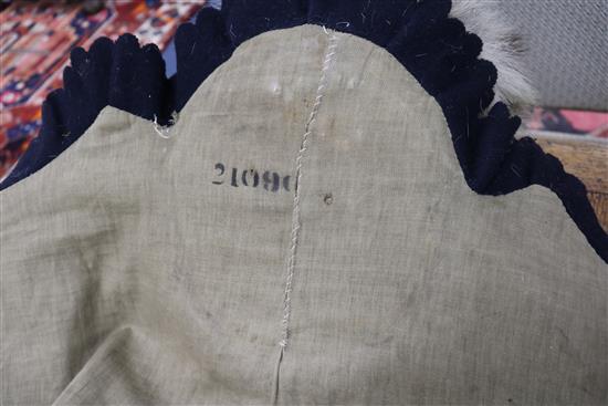 A tiger skin rug, complete with head and claws